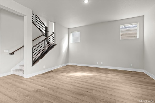 21202 E 63rd Dr, Aurora, CO 80019 - basement featuring recessed lighting, baseboards, stairway, and light wood-style floors