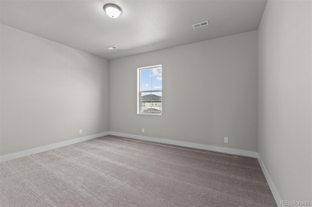 21202 E 63rd Dr, Aurora, CO 80019 - empty room featuring carpet flooring, baseboards, and visible vents