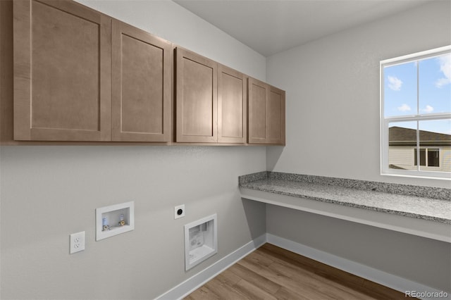 21202 E 63rd Dr, Aurora, CO 80019 - clothes washing area featuring hookup for an electric dryer, cabinet space, wood finished floors, baseboards, and hookup for a washing machine