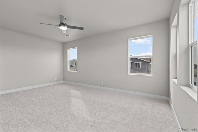 21202 E 63rd Dr, Aurora, CO 80019 - unfurnished room with baseboards, a ceiling fan, and light colored carpet