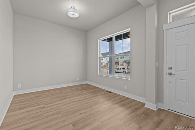 21202 E 63rd Dr, Aurora, CO 80019 - entrance foyer with light wood-style floors, baseboards, and visible vents