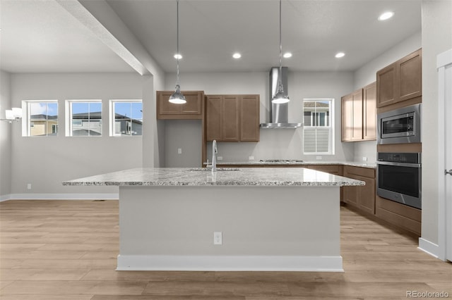 21202 E 63rd Dr, Aurora, CO 80019 - kitchen with wall chimney range hood, baseboards, stainless steel appliances, and recessed lighting