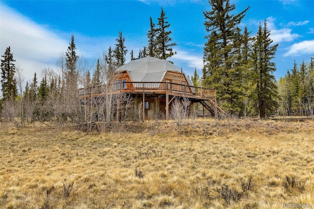 902 Hawk Way, Jefferson, CO 80456 - back of property featuring a wooden deck and stairway