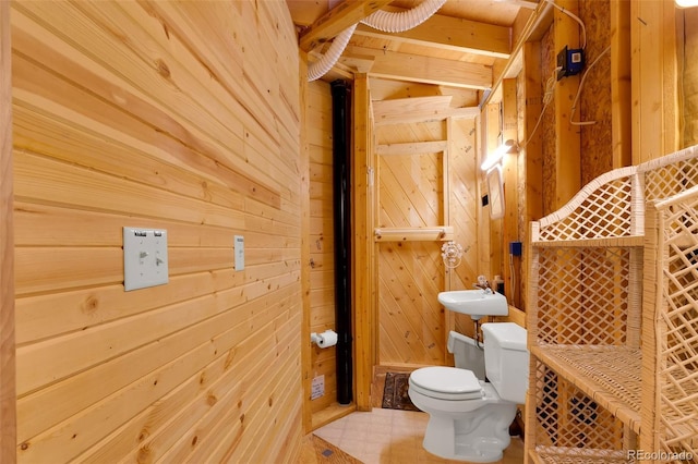 902 Hawk Way, Jefferson, CO 80456 - half bath with toilet, wood walls, and a sink