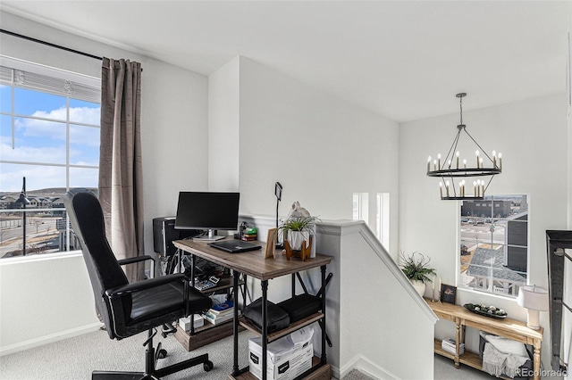 office area featuring baseboards, a chandelier, and carpet flooring