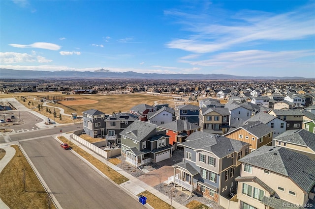 drone / aerial view featuring a residential view and a mountain view