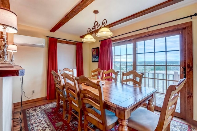 dining room featuring plenty of natural light, an AC wall unit, beamed ceiling, and hardwood / wood-style flooring