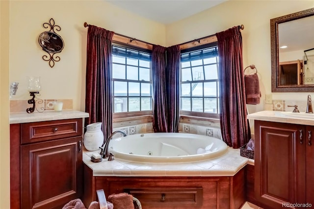 bathroom with a bath and vanity