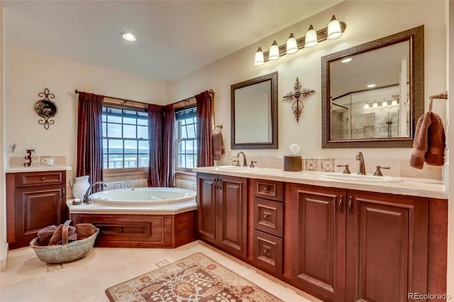 bathroom featuring dual vanity, tile patterned floors, and a bathing tub