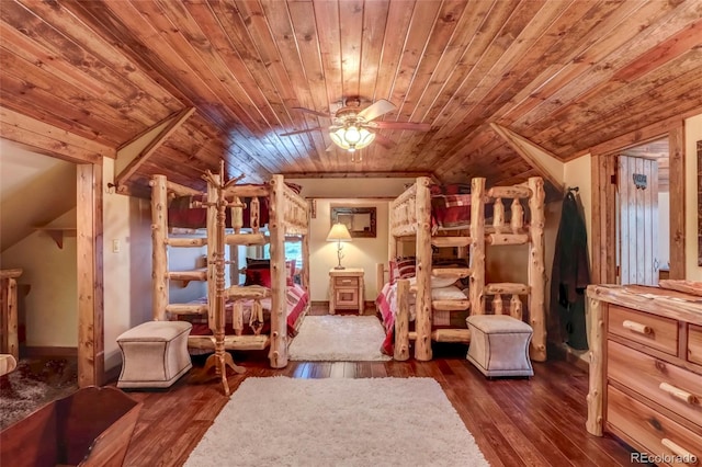 bedroom featuring lofted ceiling, dark hardwood / wood-style flooring, and wooden ceiling