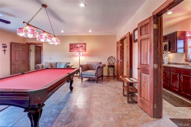 game room with tile patterned flooring, pool table, and sink