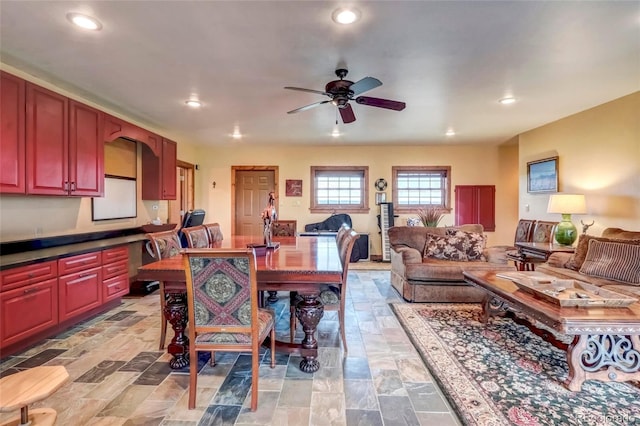 dining area featuring light tile patterned floors and ceiling fan