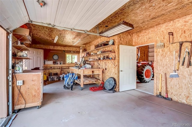 garage with a workshop area