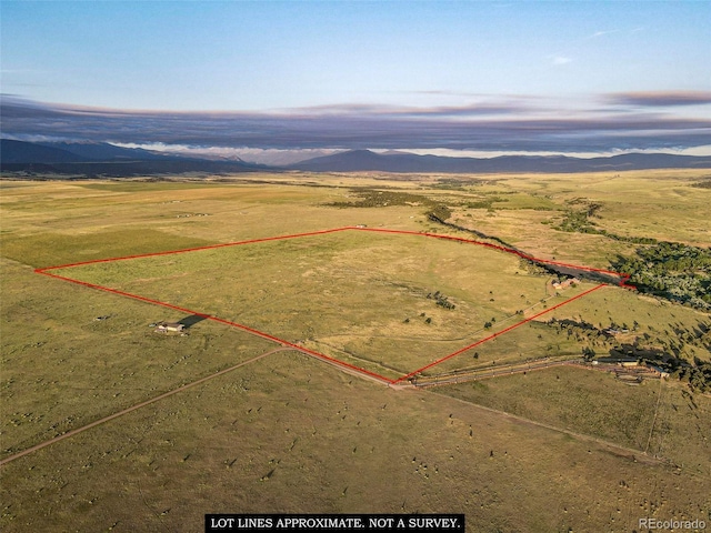 aerial view with a mountain view and a rural view