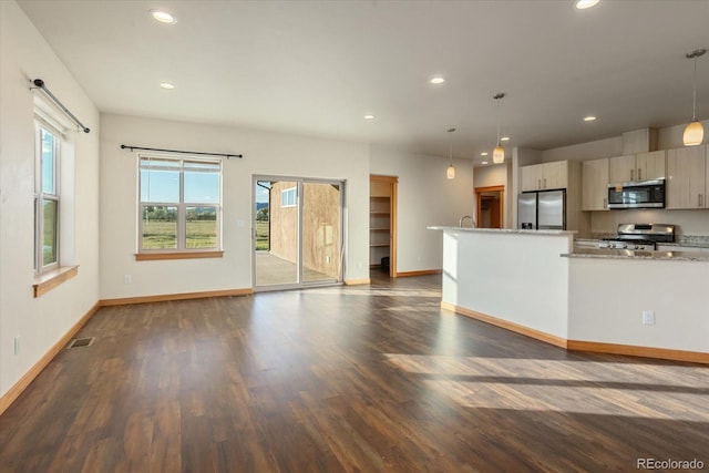 133 Starbuck Cir, Salida, CO 81201 - kitchen with appliances with stainless steel finishes, plenty of natural light, dark wood-style floors, and recessed lighting