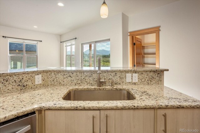 133 Starbuck Cir, Salida, CO 81201 - kitchen featuring light brown cabinets, stainless steel dishwasher, light stone countertops, recessed lighting, and hanging light fixtures