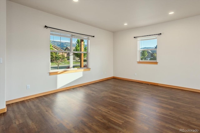 133 Starbuck Cir, Salida, CO 81201 - empty room with plenty of natural light, wood finished floors, and recessed lighting