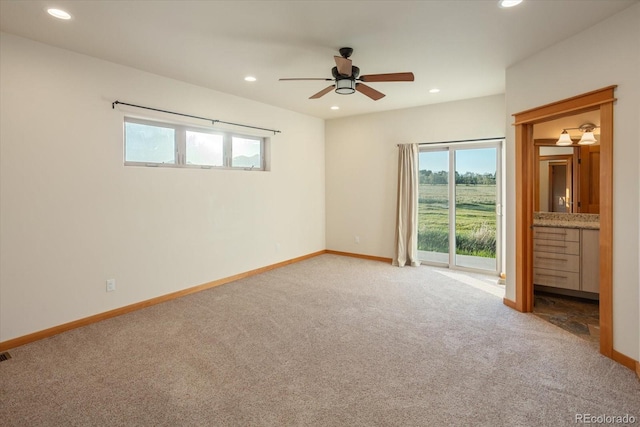 133 Starbuck Cir, Salida, CO 81201 - carpeted empty room featuring plenty of natural light, recessed lighting, a ceiling fan, and bar area
