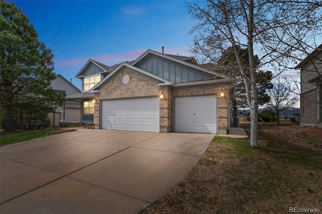 view of front of house featuring concrete driveway, an attached garage, and board and batten siding