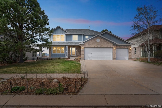 view of front of house featuring a shingled roof, concrete driveway, an attached garage, board and batten siding, and a front yard