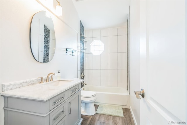 bathroom featuring shower / bathing tub combination, wood finished floors, vanity, and toilet