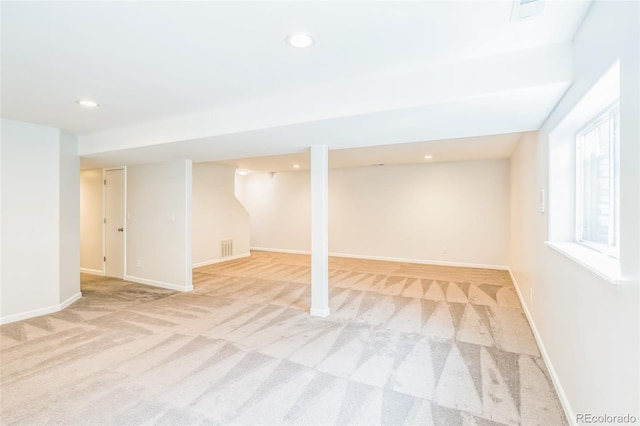 below grade area with baseboards, carpet floors, visible vents, and recessed lighting