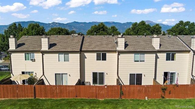 rear view of house with a mountain view