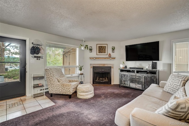 living room with tile patterned flooring and a textured ceiling