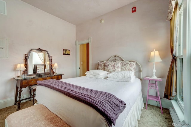 204 N F St Unit D3, Salida, CO 81201 - bedroom featuring a baseboard heating unit, light carpet, and electric panel