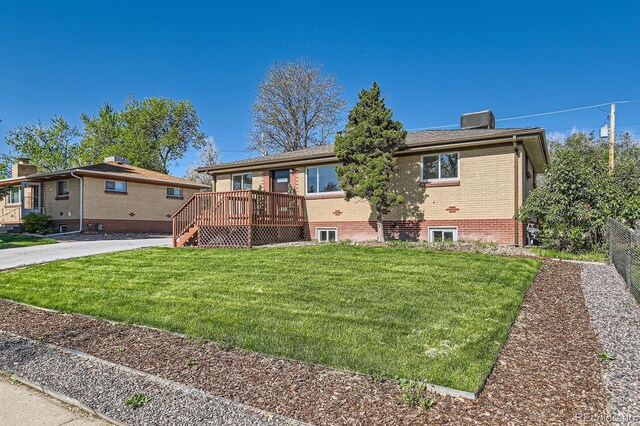 3871 Moore St, Wheat Ridge, CO 80033 - view of front of property with brick siding, a wooden deck, and a chimney