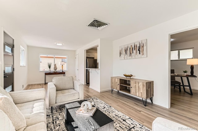 3871 Moore St, Wheat Ridge, CO 80033 - living room with light wood finished floors and baseboards