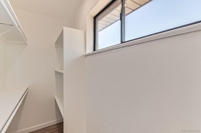 3871 Moore St, Wheat Ridge, CO 80033 - walk in closet featuring wood finished floors