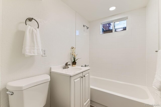 3871 Moore St, Wheat Ridge, CO 80033 - bathroom with toilet, bathtub / shower combination, and vanity