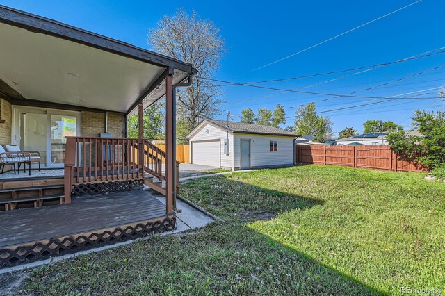 3871 Moore St, Wheat Ridge, CO 80033 - view of yard with a detached garage, an outbuilding, and a deck