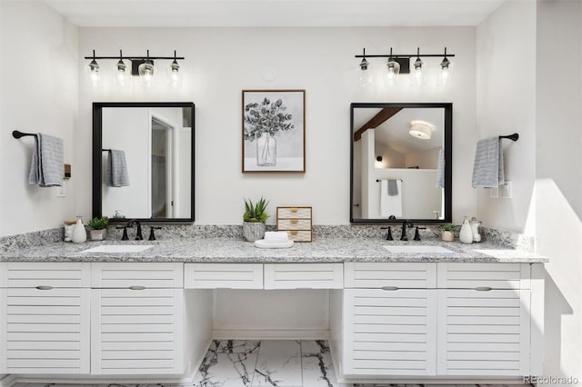 bathroom featuring tile patterned flooring and double sink vanity