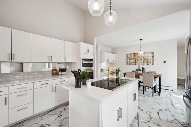 kitchen with light tile patterned flooring, white cabinetry, stainless steel double oven, and black electric stovetop