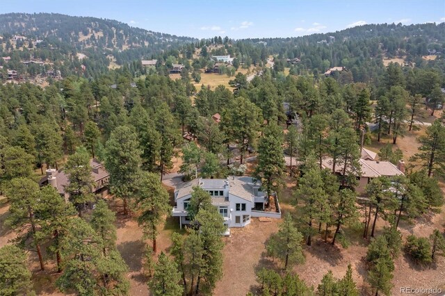 birds eye view of property with a mountain view