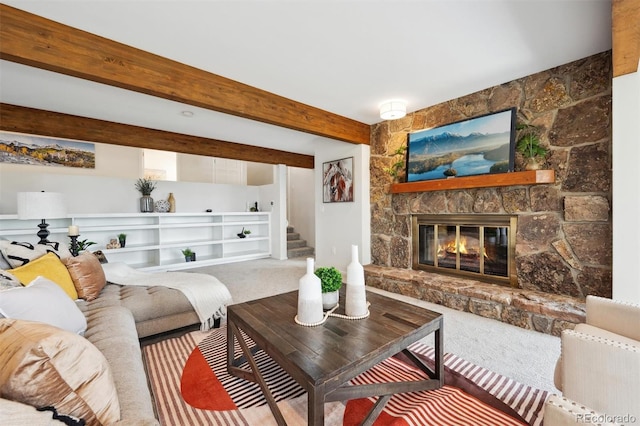 carpeted living room featuring a fireplace and beam ceiling