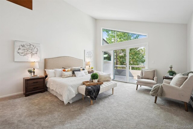 bedroom with access to exterior, light carpet, and high vaulted ceiling