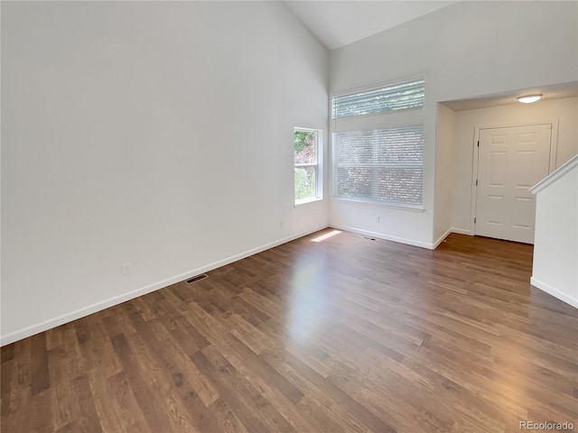 5966 S Winnipeg St, Aurora, CO 80015 - empty room with high vaulted ceiling and wood finished floors