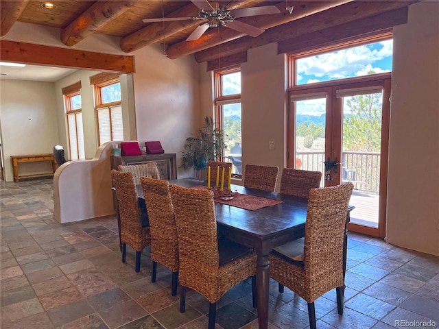 tiled dining room featuring beamed ceiling, ceiling fan, french doors, and wooden ceiling