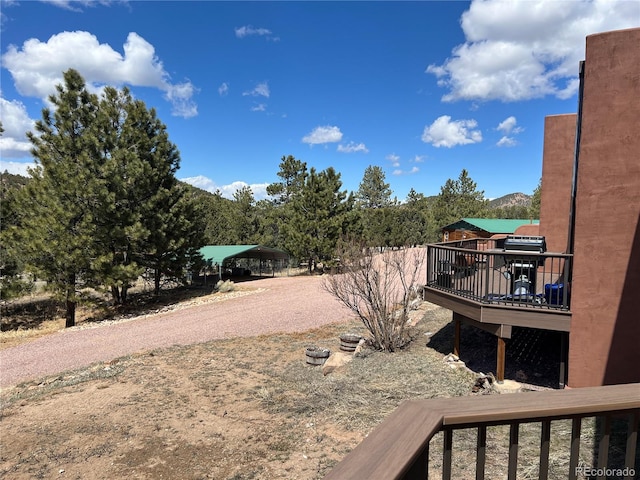 view of yard featuring a balcony