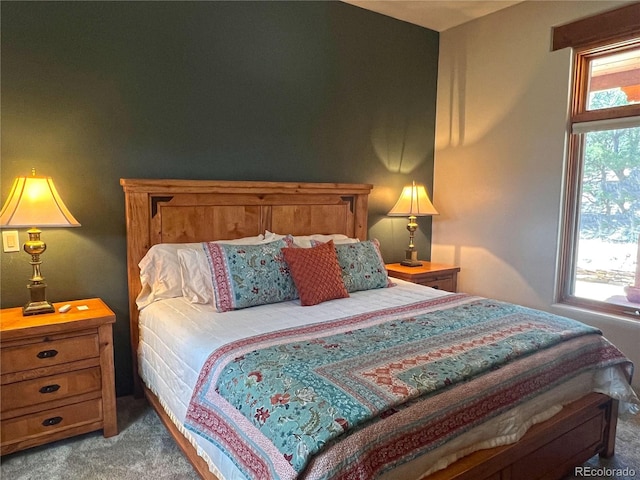 bedroom with multiple windows and carpet floors