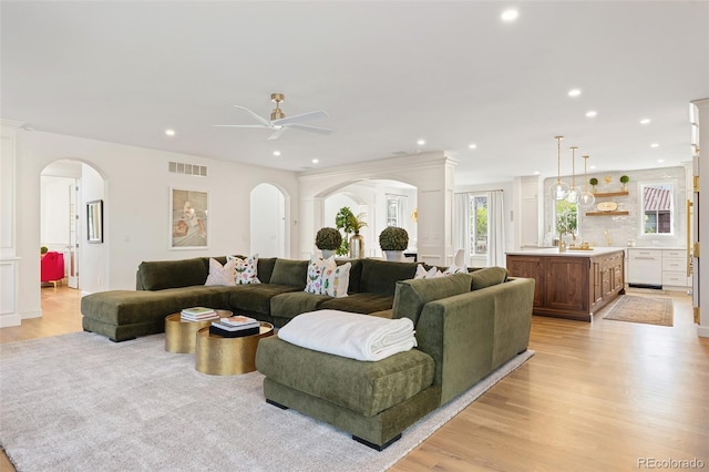 living area with light wood-style floors, visible vents, ceiling fan, and recessed lighting