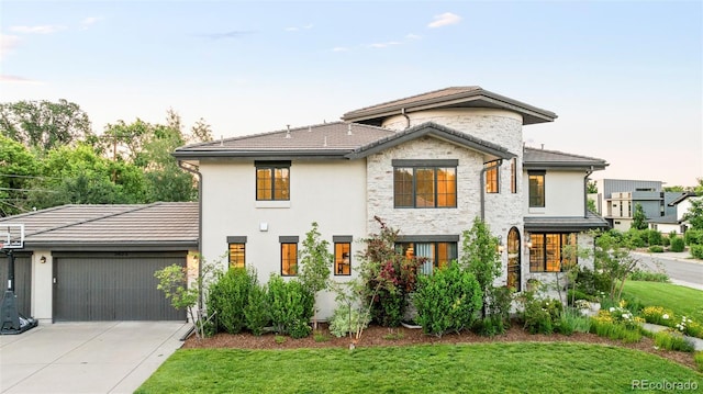 5455 E Cedar Ave, Denver, CO 80246 - view of front of property with concrete driveway, a garage, a front yard, and a tile roof
