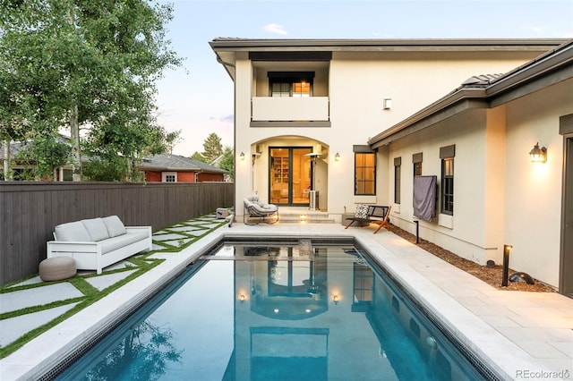 5455 E Cedar Ave, Denver, CO 80246 - back of house featuring stucco siding, a fenced backyard, and a patio