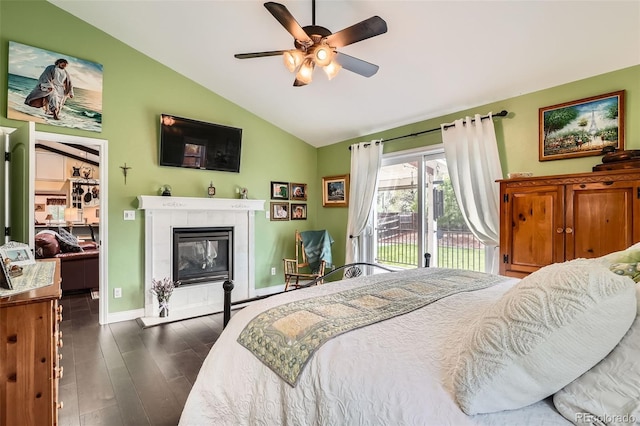 15325 W 32nd Ave, Golden, CO 80401 - bedroom with baseboards, dark wood finished floors, vaulted ceiling, access to outside, and a tiled fireplace