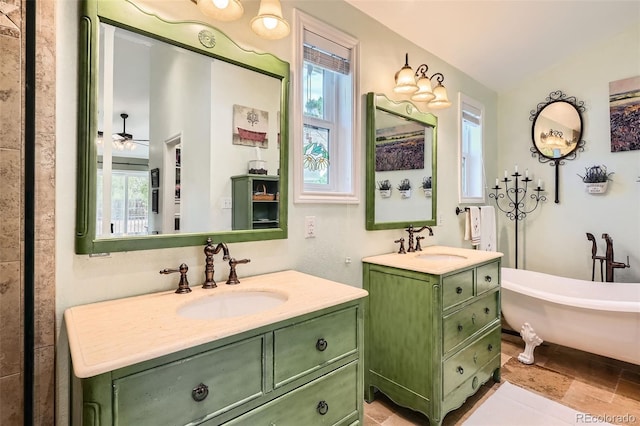 15325 W 32nd Ave, Golden, CO 80401 - bathroom featuring two vanities, a healthy amount of sunlight, and a sink