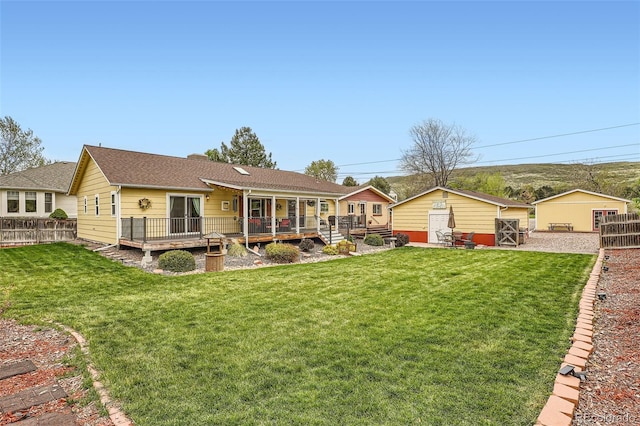15325 W 32nd Ave, Golden, CO 80401 - exterior space featuring roof with shingles, fence, an outdoor structure, a wooden deck, and a front lawn