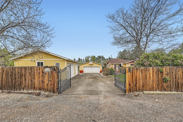 15325 W 32nd Ave, Golden, CO 80401 - view of property exterior featuring a fenced front yard, an outdoor structure, a gate, and a garage